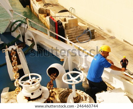 GOZO ISLAND, MALTESE ISLANDS ,EUROPE - DECEMBER 5, 2014. Men working on a ferry boat who cruising to  Gozo Island , one of the most visited island of Maltese Islands.