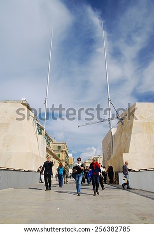 VALLETTA, ISLAND OF MALTA ,EUROPE - NOVEMBER 4,2014. People at  the entrance of City Gate  - main entrance to Malta\'s capital city, Valletta, a UNESCO World Heritage Site.