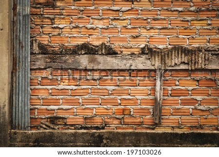 Red brick wall with  weathered cement  background