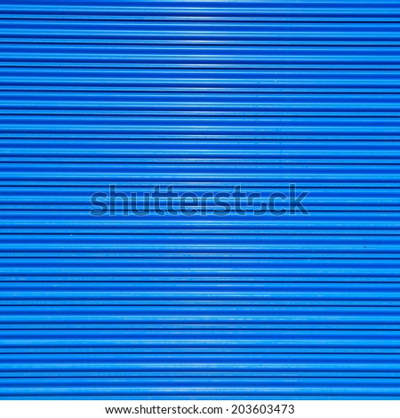 a shuttered roll up metal blue door