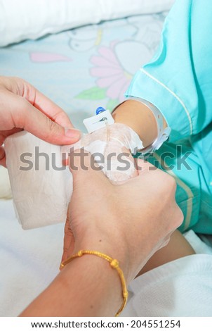 Hand of sick little girl at hospital