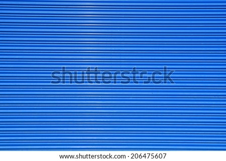 a shuttered roll up metal blue door