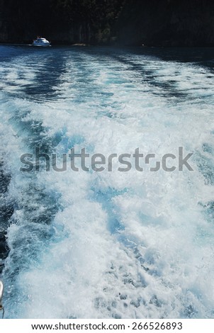 Churning sea water from Speed boat wake in the sea wave splash