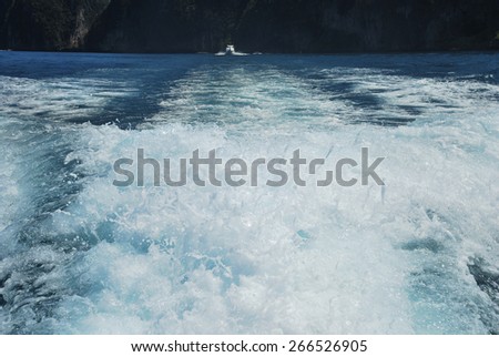 Churning sea water from Speed boat wake in the sea wave splash