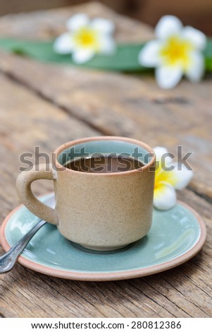 Coffee  cup mug on old wooden table with nature light