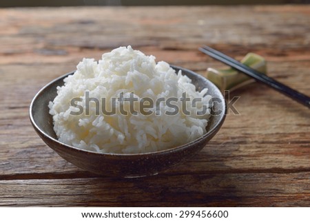 Bowl of Organic White Rice with chop sticks