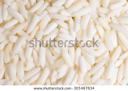 White sticky rice as a food background, Uncooked raw cereals, Macro closeup background