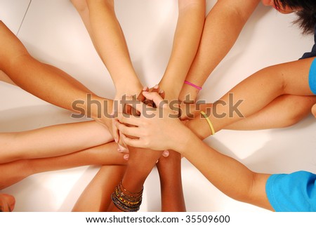 hands stack together
