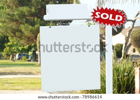 house for sale and sold sign