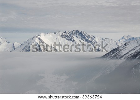 Italy. Aosta. Foggy lake over Valley Aosta. Mountain landscape