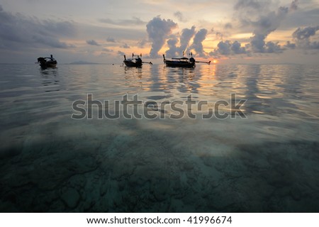 Thailand. Phi Phi island. Magic sunrise landscape with thai boats