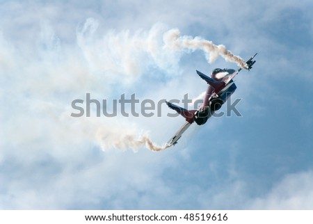 RUSSIA, MAKS - AUGUST 28: MIG-29 OVT fighter performing aerobatic elements and ejecting thermal traps (salute) at MAKS  aviation salon August 28, 2007 in Zhukovski, Russia