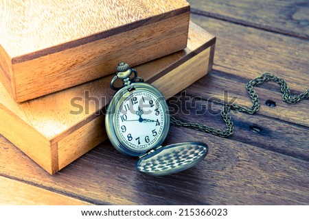 Pocket watch and wooden box, vintage style