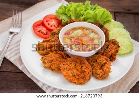 Fried fish cake and vegetables on plate, Thai food