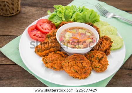 Fried fish cake and vegetables on plate, Thai food