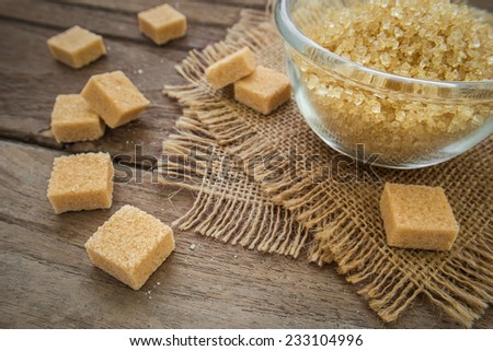 Brown sugar cubes on wooden table