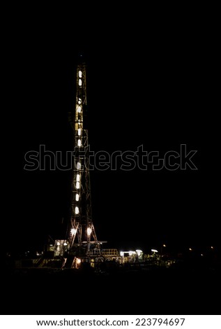 Drilling for oil 24 hrs a day, a rig runs all night with a full crew under the lights.
