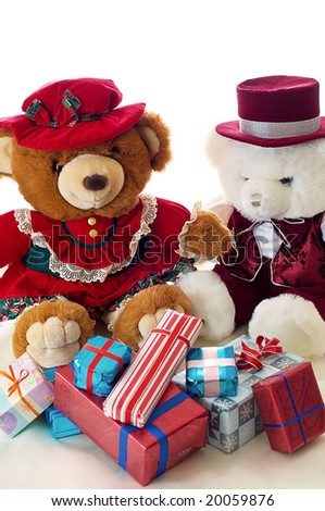 Two teddy bears exchange gifts for Christmas