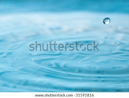 A single drop is suspended in air after a water drip
