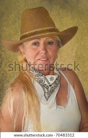 Ranch woman with cowboy hat ready to herd cows.