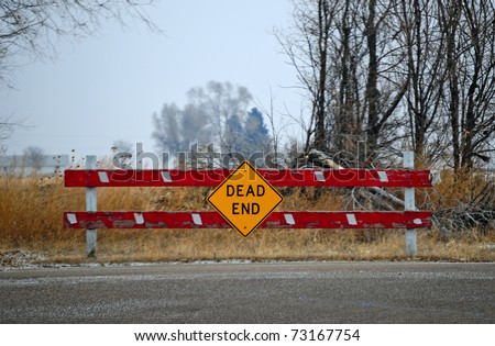 Dead end sign could represent various jobs or relationships. The gloomy sky adds to the feeling of frustration.