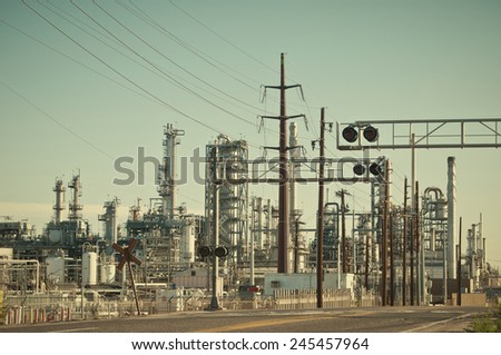Oil refinery for creation of gasoline and oil from natural crude oil. Retro instagram look.