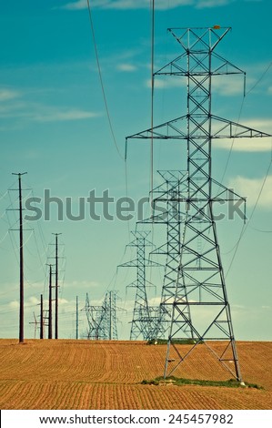 High voltage lines crossing newly planted fields in north central Colorado, USA. retro instagram look