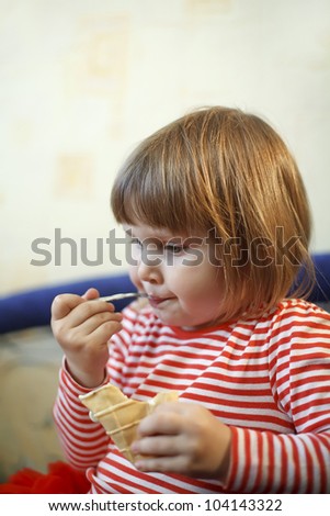 little blond girl spoon eating ice cream pastry dirty mouth