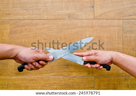 knife fighting (both hand holding knife and cross together