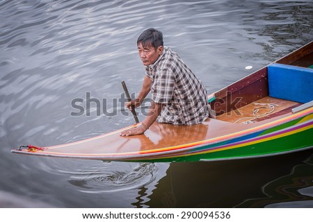 Thailand May 1,2015. man on boat for rent between waiting for tourist in Klung district ,Chantaburi town Thailand.