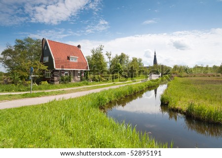 Traditional country house and church in Amstelveen, the Netherlands