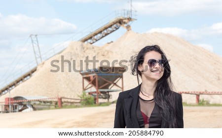 business jet set woman at industrial arabian building
