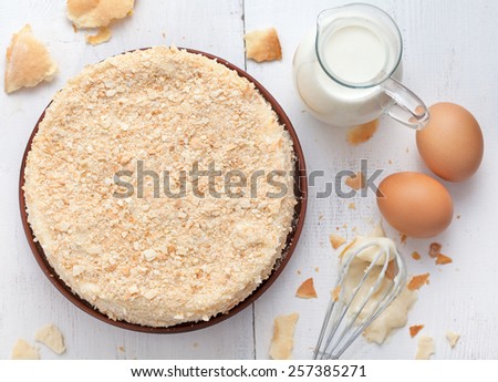 Mille feuille cake in vintage provence style background with milk, eggs and lavender