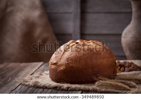 Traditional homemade christmas panettone bread italian cake holiday dessert in rustic style on vintage wooden background.