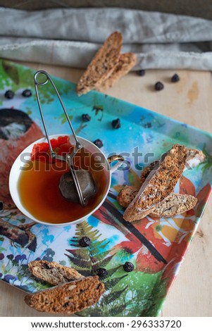 Biscotti with dried cherry and a cup of tea