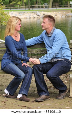 happily married couple sharing a romantic moment out in the park