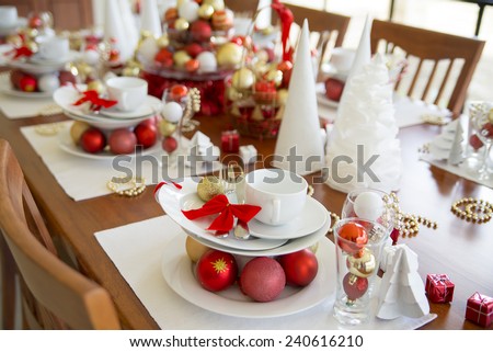 new year table setting decorated with ornaments, christmas table setting