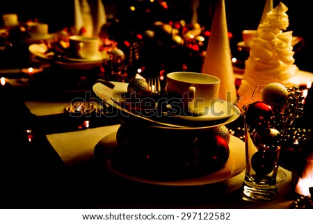 christmas eve table setting with ornaments, new year eve table setting with color burn retouch effect