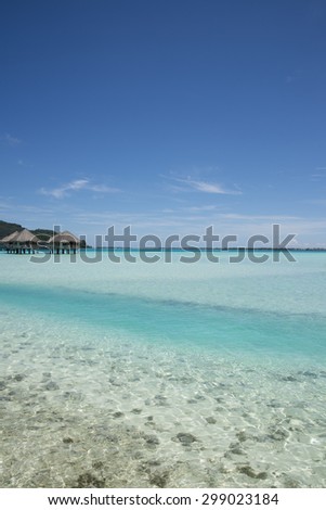 Paradise view of turquoise lagoon on the tropical island of Bora Bora, near Tahiti, in French Polynesia