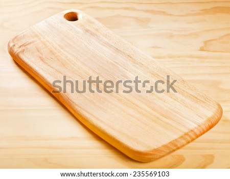 Empty vintage cutting board on planks, food background, concept
