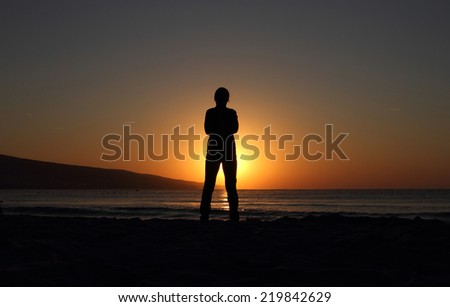 contour of man on a background of the rising sun over the horizon