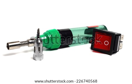 compact gas soldering iron and switch on a white background