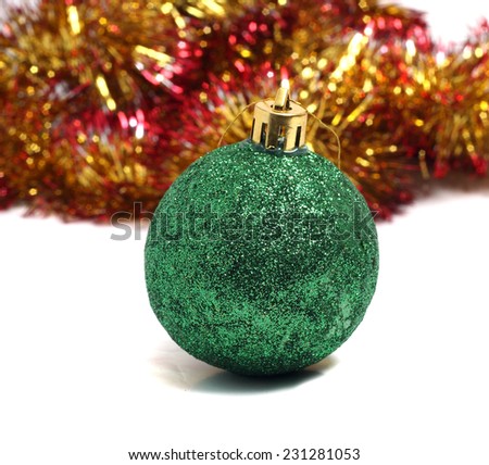 Christmas ball on green background of holiday decorations