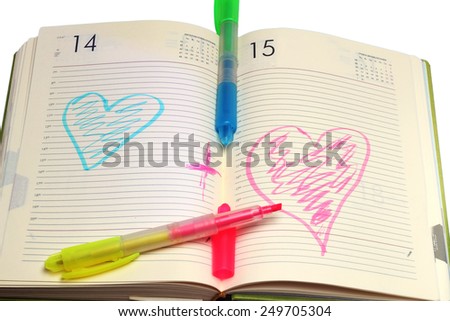 notebook and two marker on a white background