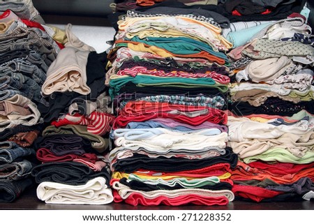 Many different clothes in the closet