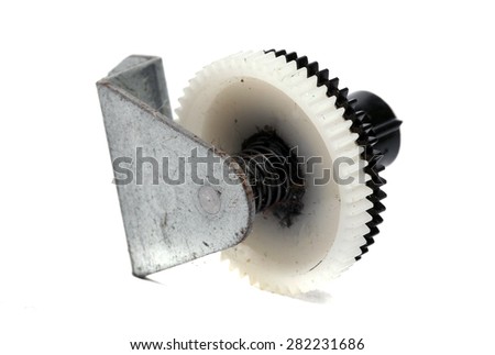 dusty plastic gear with fastening on a white background