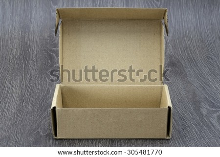 Blank brown box mock up on wood background