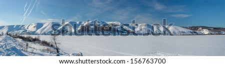 Panoramic views of the beautiful hilly bank of the river in winter. Russia, Tatarstan, the Kama River, Lower Kama region.