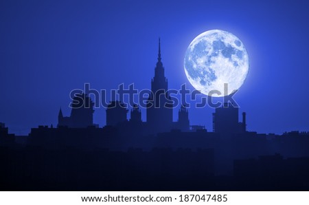 Moscow. Silhouette of the Moscow State University (MSU) on the background of a big moon. Collage