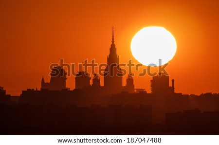 Moscow. Silhouette of the Moscow State University (MSU) on the background of a large the sunset sun